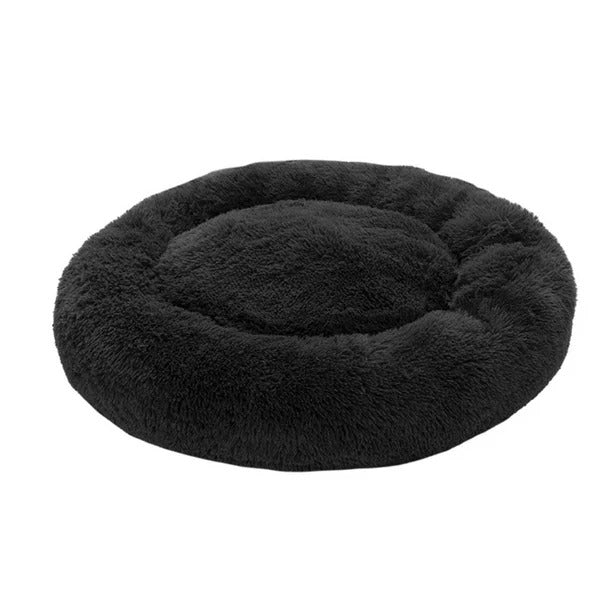 Cama para mascota en forma de dona color negro con textura de felpa suave y bordes elevados